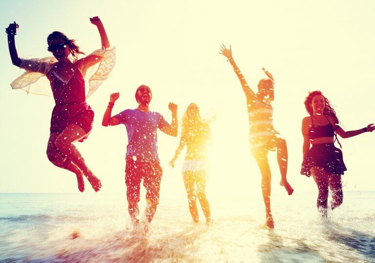 Young people having summer fun at the beach