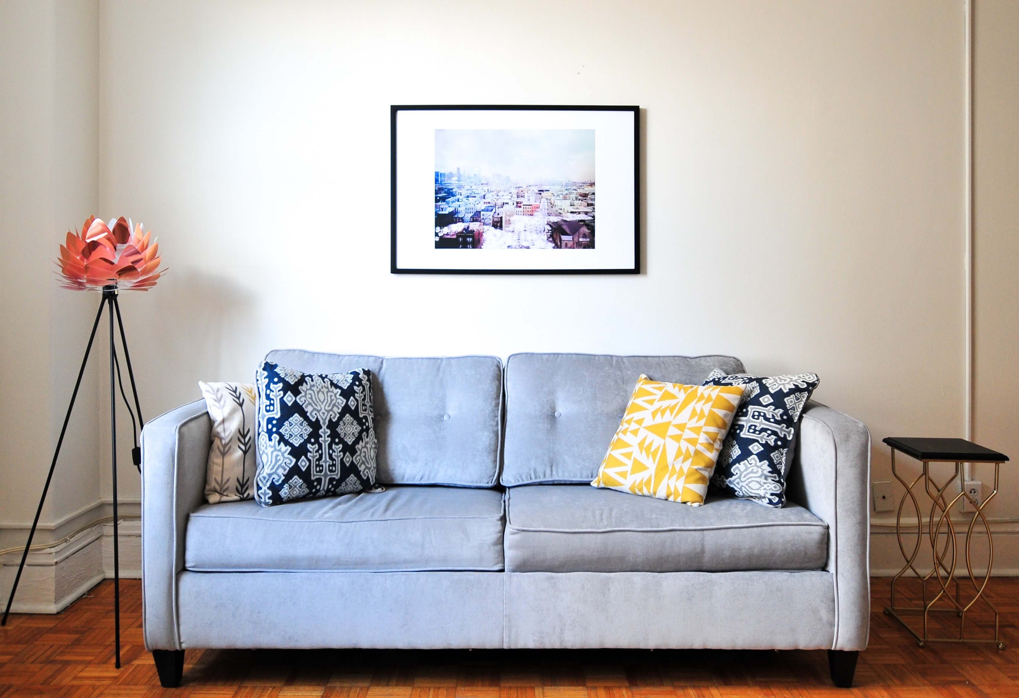 A beautiful couch and some pieces of furniture in an apartment