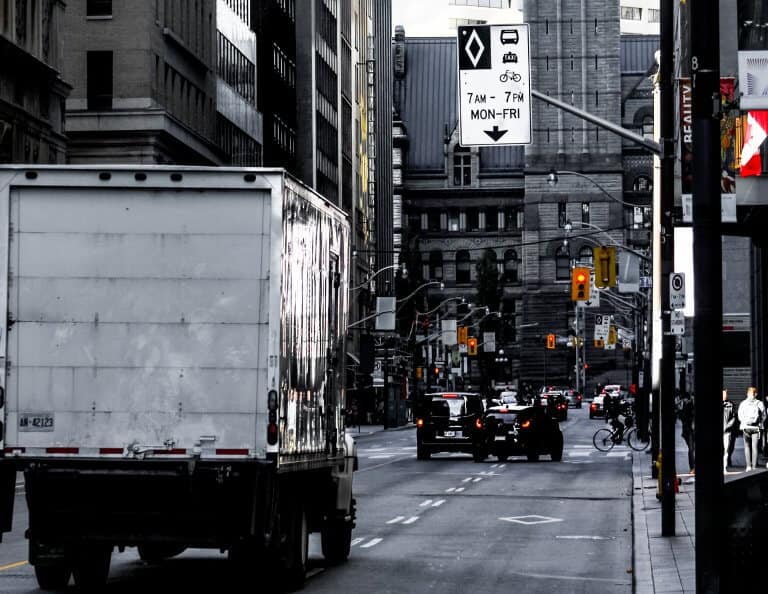 A moving truck driving on the street