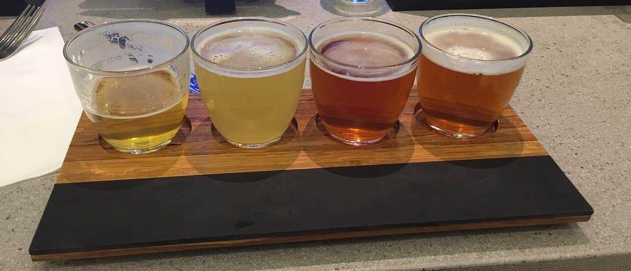 4 small beer glasses on desk