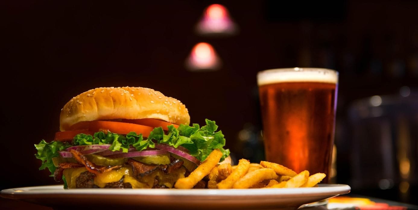 Burger and beer on the bar table