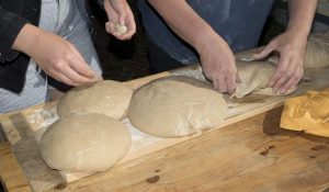 Pizza dough being handcrafted by Chicago Pizza & Oven Grinder Co.