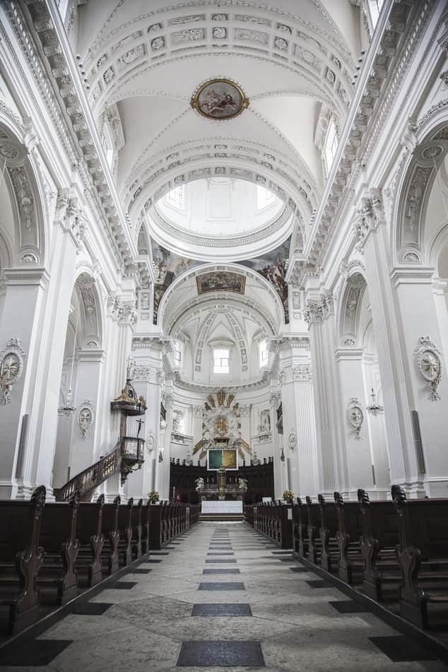 The Basilica of St. Patrick's Old Cathedral with white walls and pews